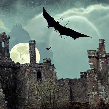 Vampir fliegt vor Burgruine bei Vollmond